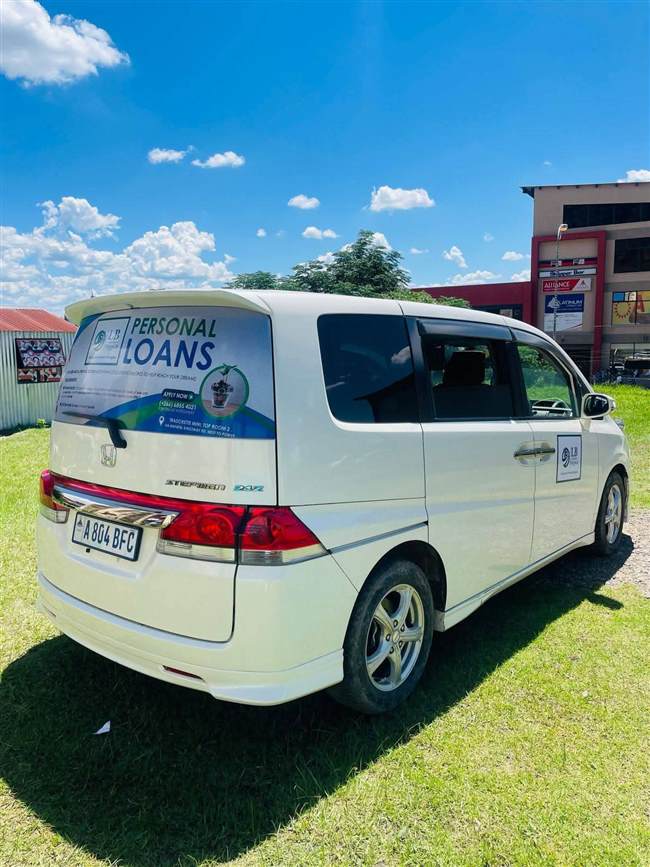 LB Microfinance vehicle side branding